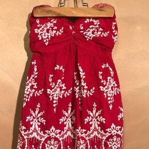 red floral sleeveless shirt
